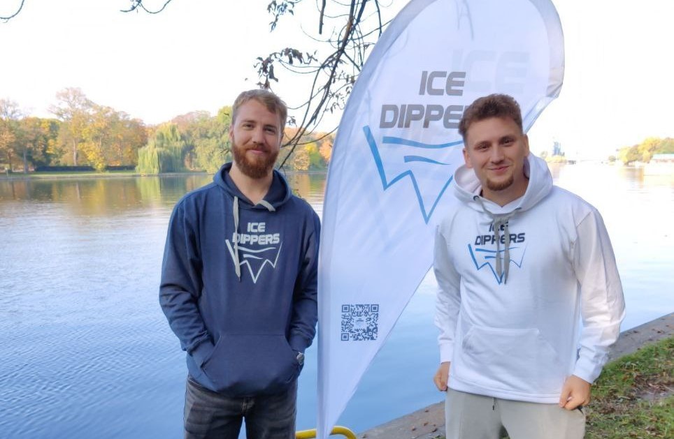 Jakob with Ice Dippers community member by the lake